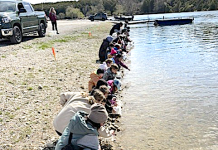 Young students learn about nature and release their raised fry into the Saugeen River